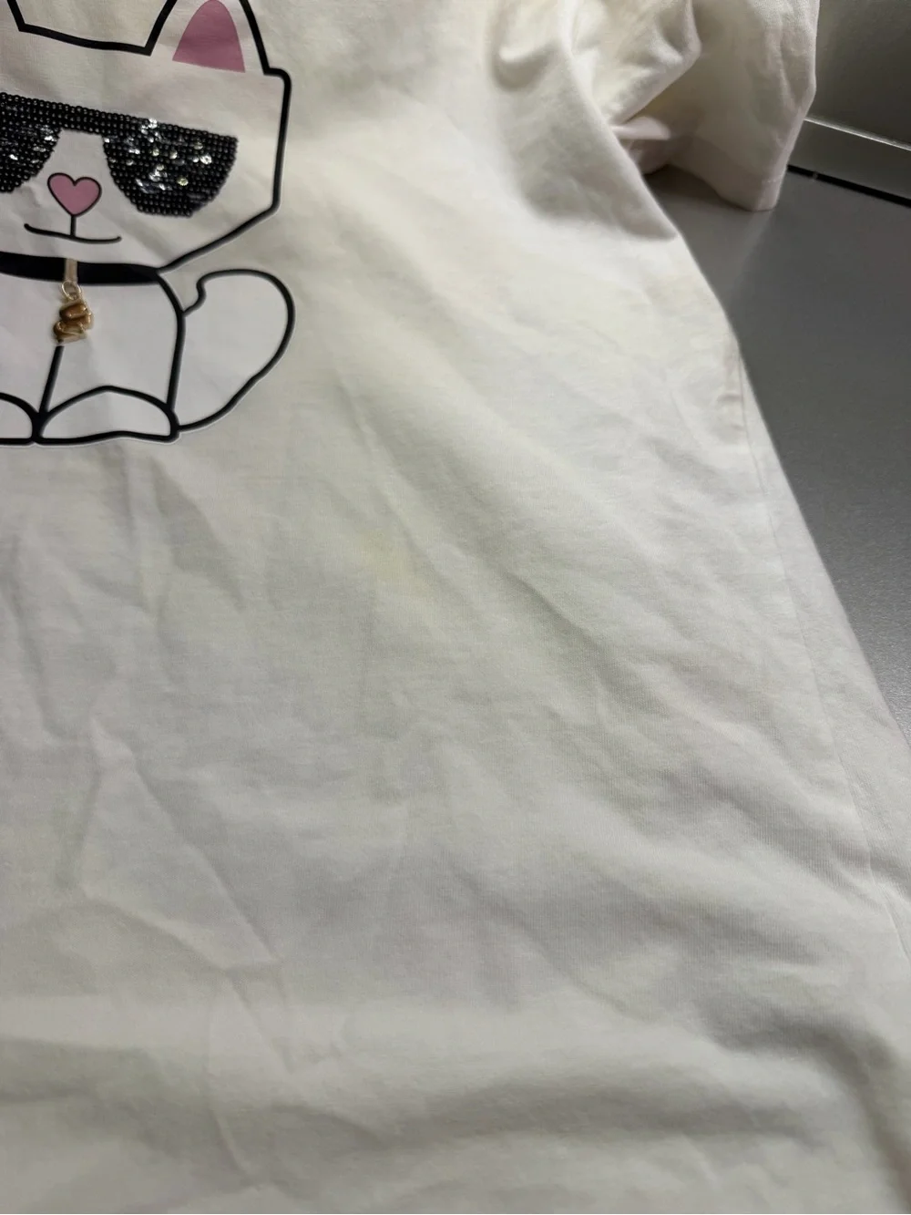 Karl Lagerfeld White Tee with Beige Cat Graphic and Pink Ear Accents